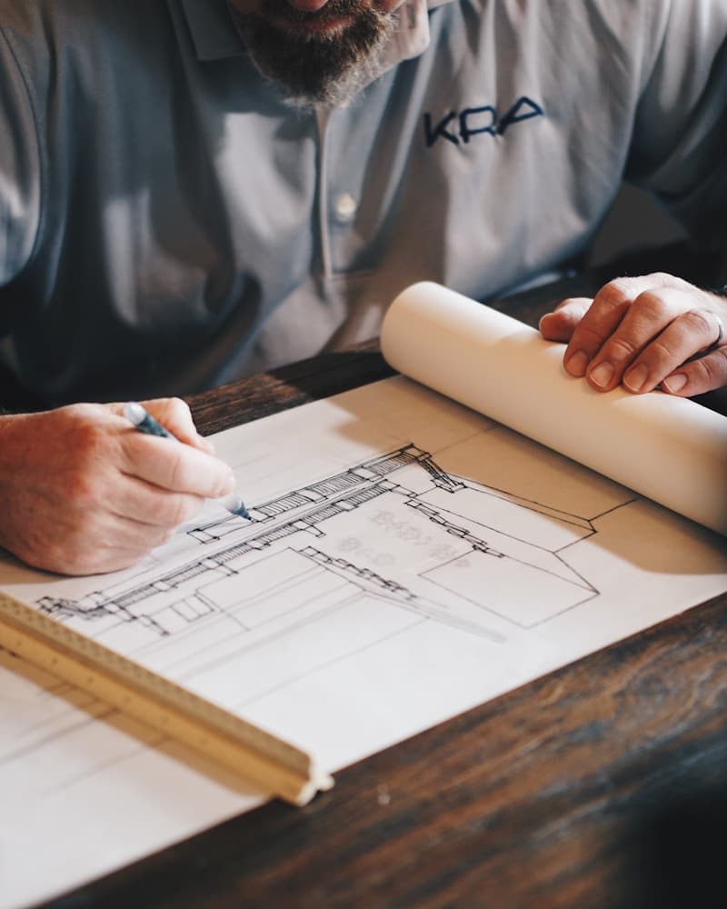 Licensed professional engineer drafting architectural and structural engineering plans